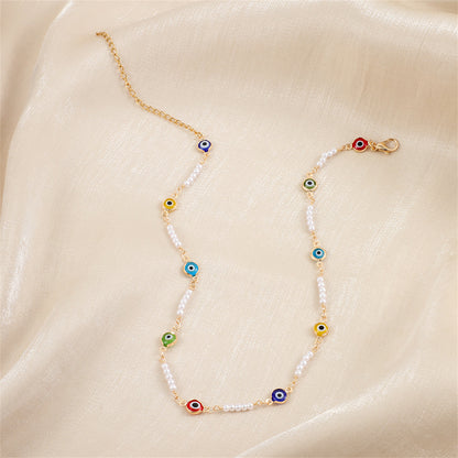Blue Acrylic and Pearl 18K Gold-Plated Eye Station Necklace, gold pendant necklace for women, detail close-up