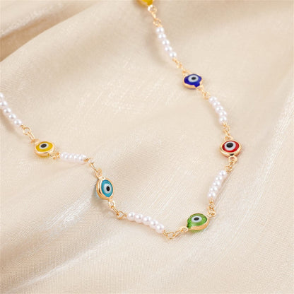 Blue Acrylic and Pearl 18K Gold-Plated Eye Station Necklace, gold pendant necklace for women, botanical inspired, front view