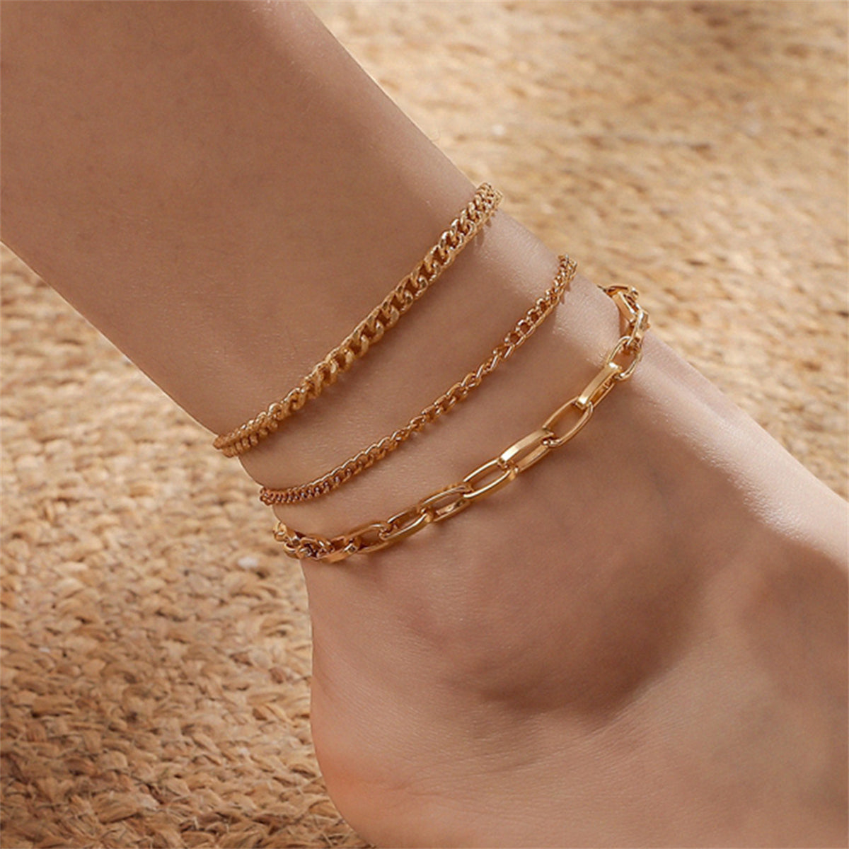 Three elegant 18K gold-plated curb chain anklets showcasing stylish chain links, perfect for any occasion.