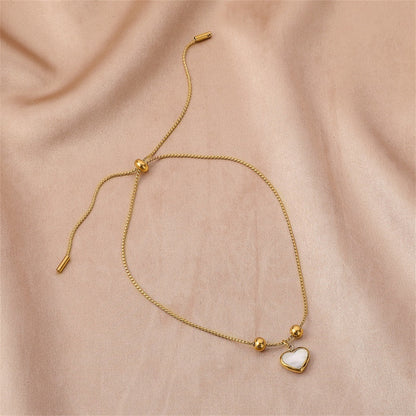 White Shell and 18K Gold-Plated Heart Charm Adjustable Bracelet, gold bracelet for women, everyday style, front view