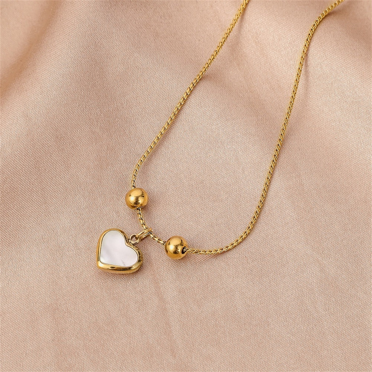 White Shell and 18K Gold-Plated Heart Charm Adjustable Bracelet, gold bracelet for women, everyday style, detail close-up