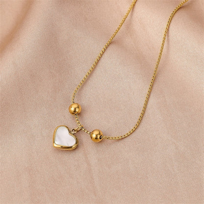 White Shell and 18K Gold-Plated Heart Charm Adjustable Bracelet, gold bracelet for women, everyday style, detail close-up