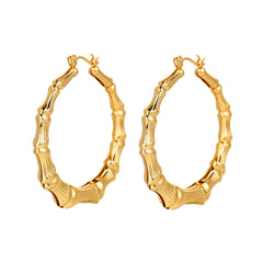 Stunning 18K gold-plated bamboo hoop earrings, perfect for elevating your style with their chic and modern design.