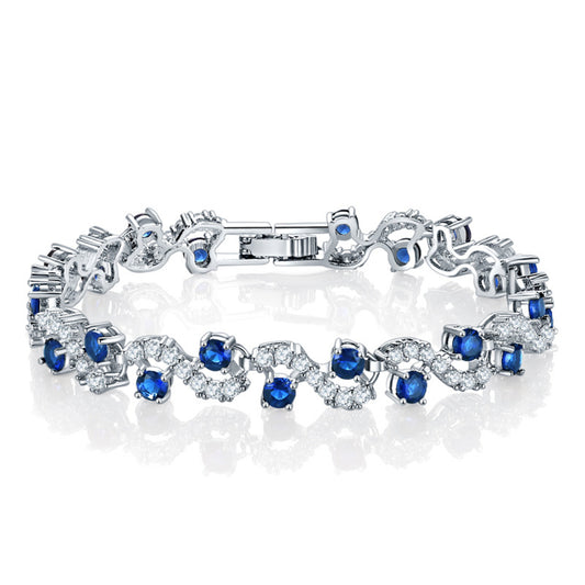 Cubic Zirconia and Blue Crystal Prong Crossing Line Tennis Bracelet, bracelet for women, everyday style, front view