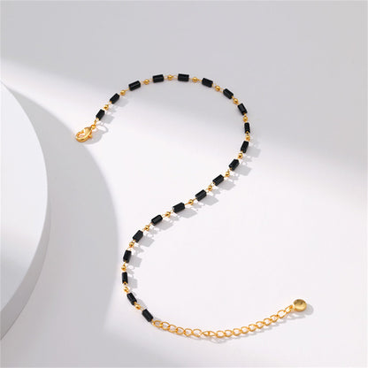 Black Acrylic and 18K Gold-Plated Beaded Anklet, gold anklet bracelet, vintage-inspired design, lifestyle look