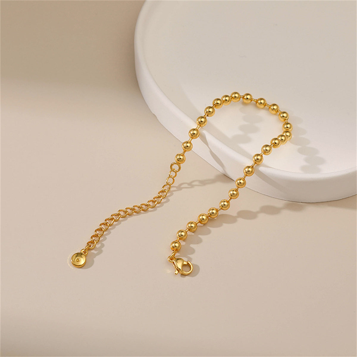 Dazzling 18K gold-plated bead chain bracelet on a white background, perfectly showcasing its beauty and sophistication.