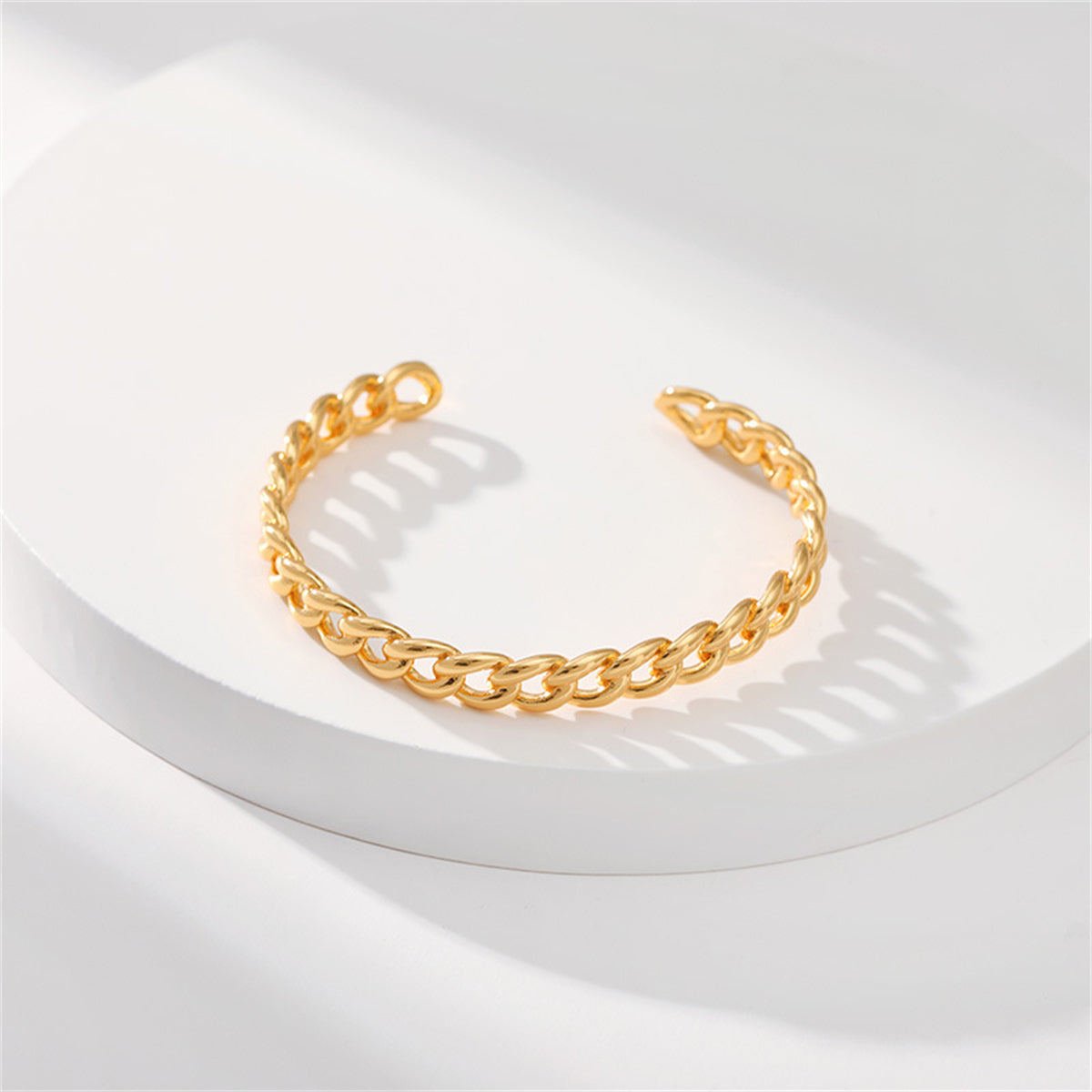 A sophisticated 18K gold-plated cuff bracelet with a twisted design, ideal for a chic and stylish accessory.