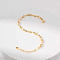 A gold bracelet featuring small oval beads, elegantly designed as an 18K gold-plated olive chain bracelet.