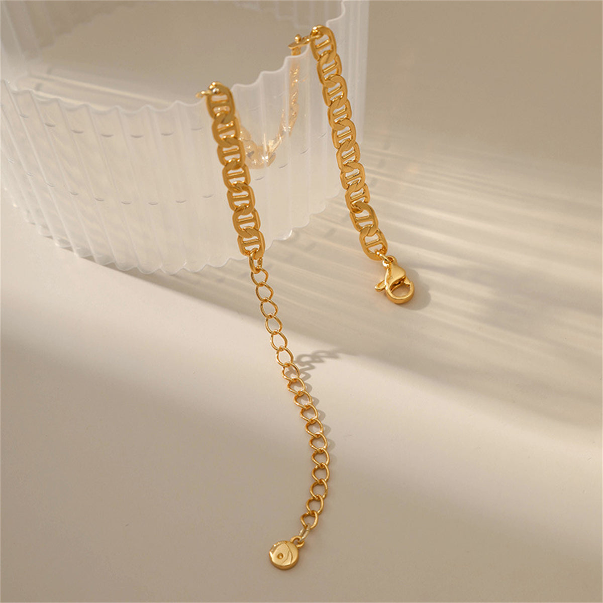 Luxurious 18K gold-plated chain bracelet with a unique link design, adding a touch of sophistication to any outfit.