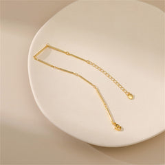 Stunning 18K gold-plated bar station bracelet crafted from a single chain link, perfect for adding elegance to any outfit.