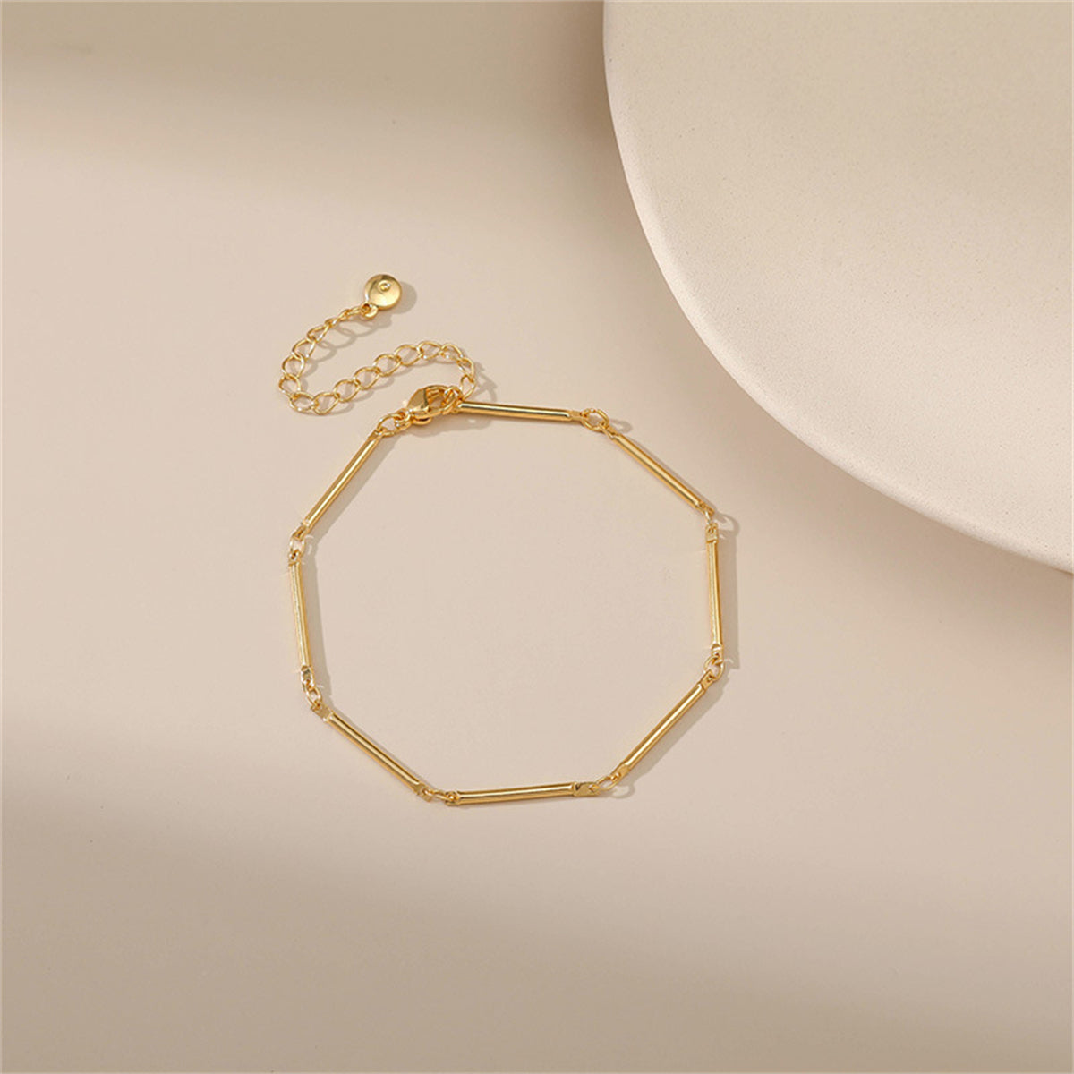 Stylish 18K gold-plated bar station bracelet featuring a minimalist single chain link design, perfect for everyday wear.