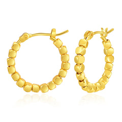 Elegant 18k gold round hoop earrings, beautifully designed with a beaded texture for a chic, timeless look.