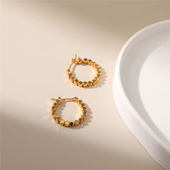 Stunning 18k gold round hoop earrings featuring a delicate beaded design, perfect for any stylish occasion.