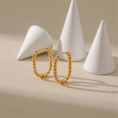 Chic 18k gold ball hoop earrings with a stylish beaded U-shape, perfect for elevating any outfit effortlessly.