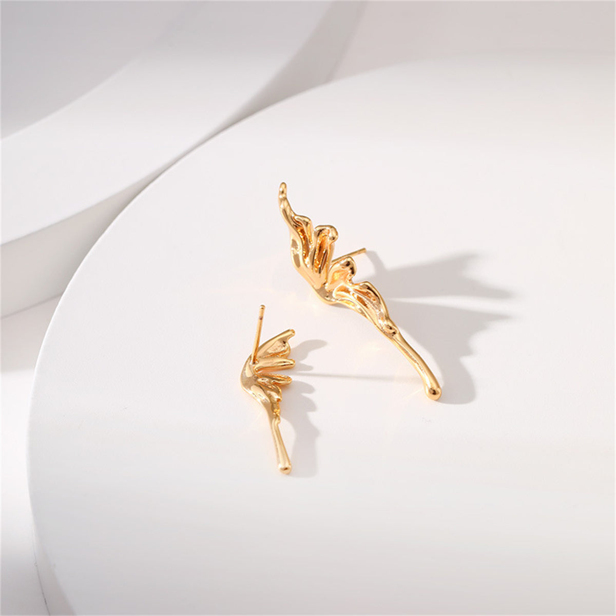 Stunning 18K gold-plated butterfly wing stud earrings, showcasing a unique design that elevates your style effortlessly.