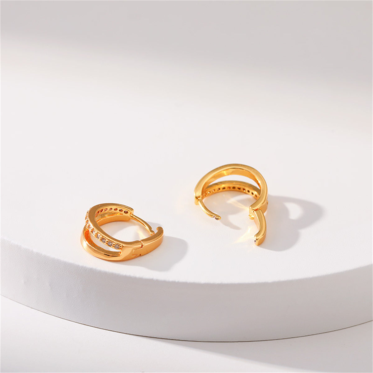 Cubic Zirconia and 18K Gold-Plated V-Shape Huggie Earrings, gold huggie earrings, dainty minimalist design, detail close-up