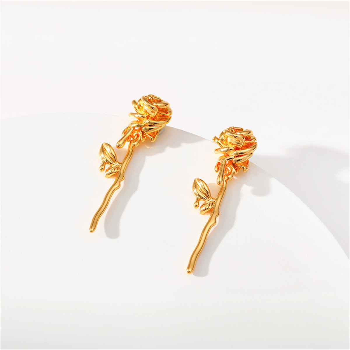 Stunning 18K gold-plated rose earrings, featuring a graceful drop design that adds charm to any outfit.