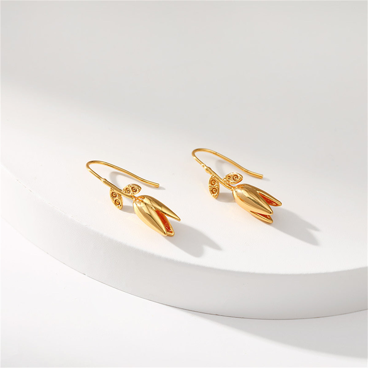 Stunning 18K gold-plated drop earrings designed with beautiful leaves and flowers for a sophisticated look.
