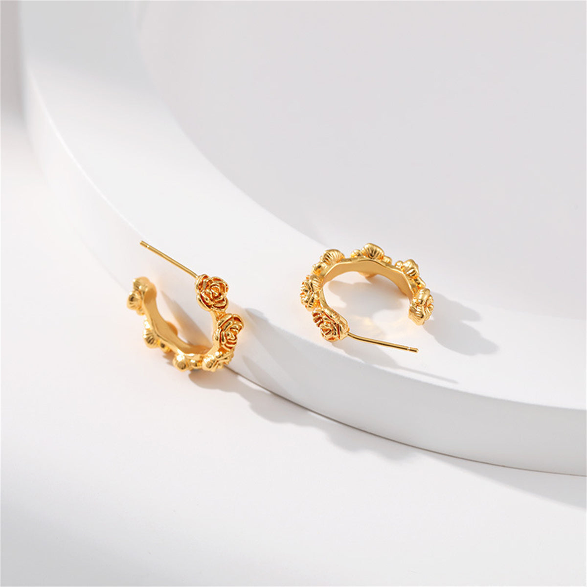 Chic 18K gold-plated rose huggie earrings, combining elegance and style in a stunning hoop design.