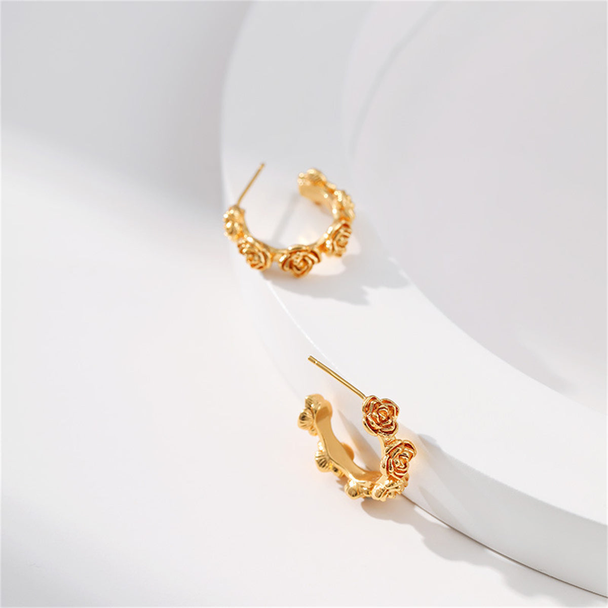 Stunning 18K gold-plated rose hoop earrings, showcasing a refined and stylish huggie design for a chic look.