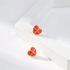 Elegant red heart-shaped stud earrings crafted with red enamel and adorned with 18K gold plating.