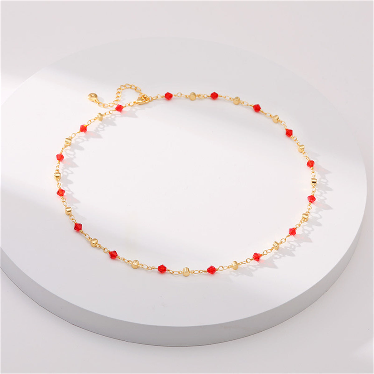 Red Acrylic and 18K Gold-Plated Station Necklace, gold pendant necklace for women, vintage-inspired design, detail close-up