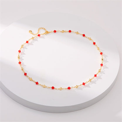 Red Acrylic and 18K Gold-Plated Station Necklace, gold pendant necklace for women, vintage-inspired design, detail close-up
