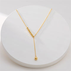Beautiful 18K gold-plated bead lariat necklace showcasing a dazzling diamond pendant.