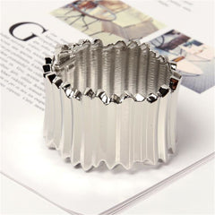 A chic silver-plated vat bangle with a substantial metal design, combining contemporary aesthetics with timeless appeal.
