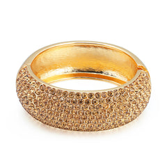 An 18K gold-plated bangle adorned with a prominent cubic zirconia stone, showcasing a sophisticated and elegant style.