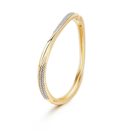 Cubic Zirconia and 18K Gold-Plated Twisted Bangle, gold bangle bracelet, botanical inspired, side view