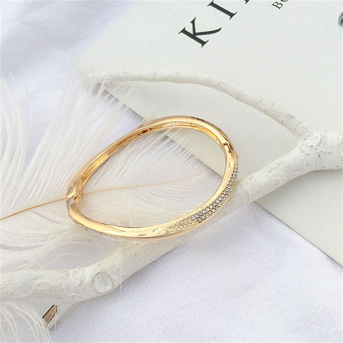 Cubic Zirconia and 18K Gold-Plated Twisted Bangle, gold bangle bracelet, botanical inspired, detail close-up