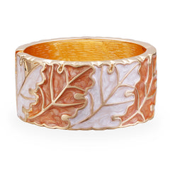 An exquisite gold and white bangle showcasing a leaf motif, enhanced with orange enamel and 18K gold plating.