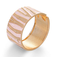 A gold and white bracelet featuring a branch pattern, crafted from white enamel and 18K gold plating.