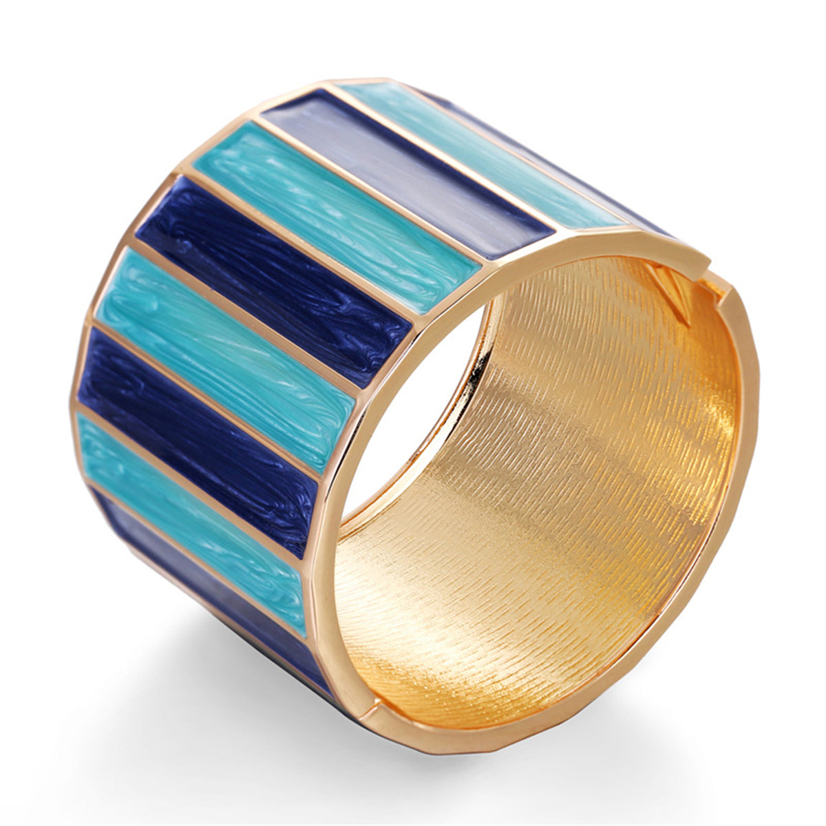 A chic blue and gold striped cuff bracelet, made from blue enamel and enhanced with 18K gold plating.