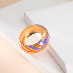A colorful bracelet featuring orange and blue stripes with gold accents, designed with luxurious 18K gold-plated stripes.