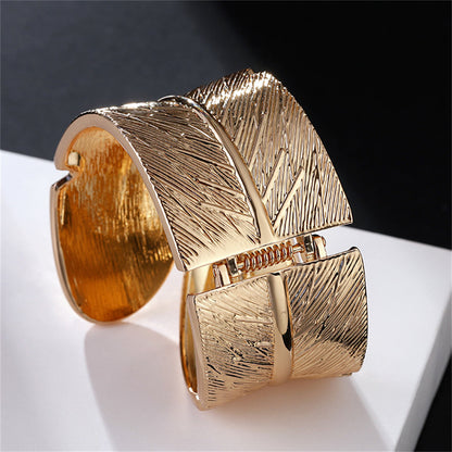 Cubic Zirconia and 18K Gold-Plated Feather Bypass Bangle, gold bangle bracelet, elegant gift for her, lifestyle look