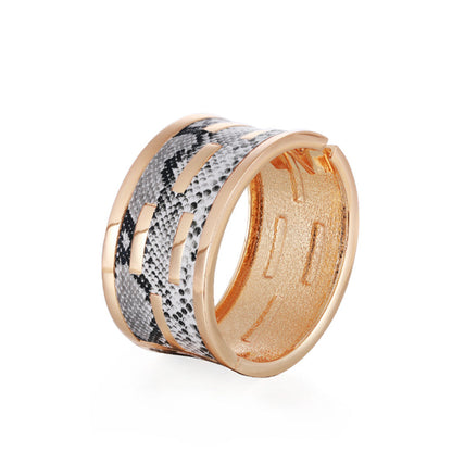 Polystyrene and 18K Gold-Plated Serpentine Bangle, gold bangle bracelet, everyday style, side view