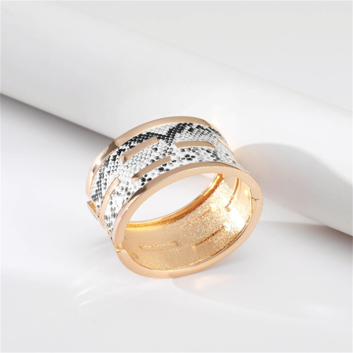 Polystyrene and 18K Gold-Plated Serpentine Bangle, gold bangle bracelet, everyday style, detail close-up