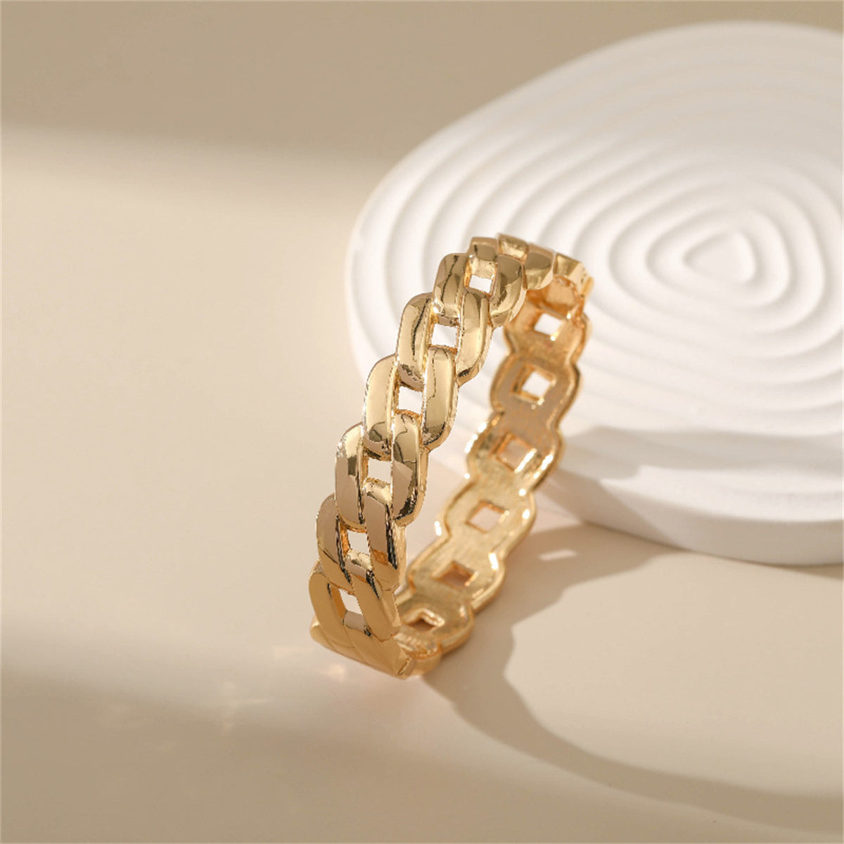 Elegant 18K gold-plated bracelet featuring a unique twisted design, perfect for adding a touch of luxury to any outfit.