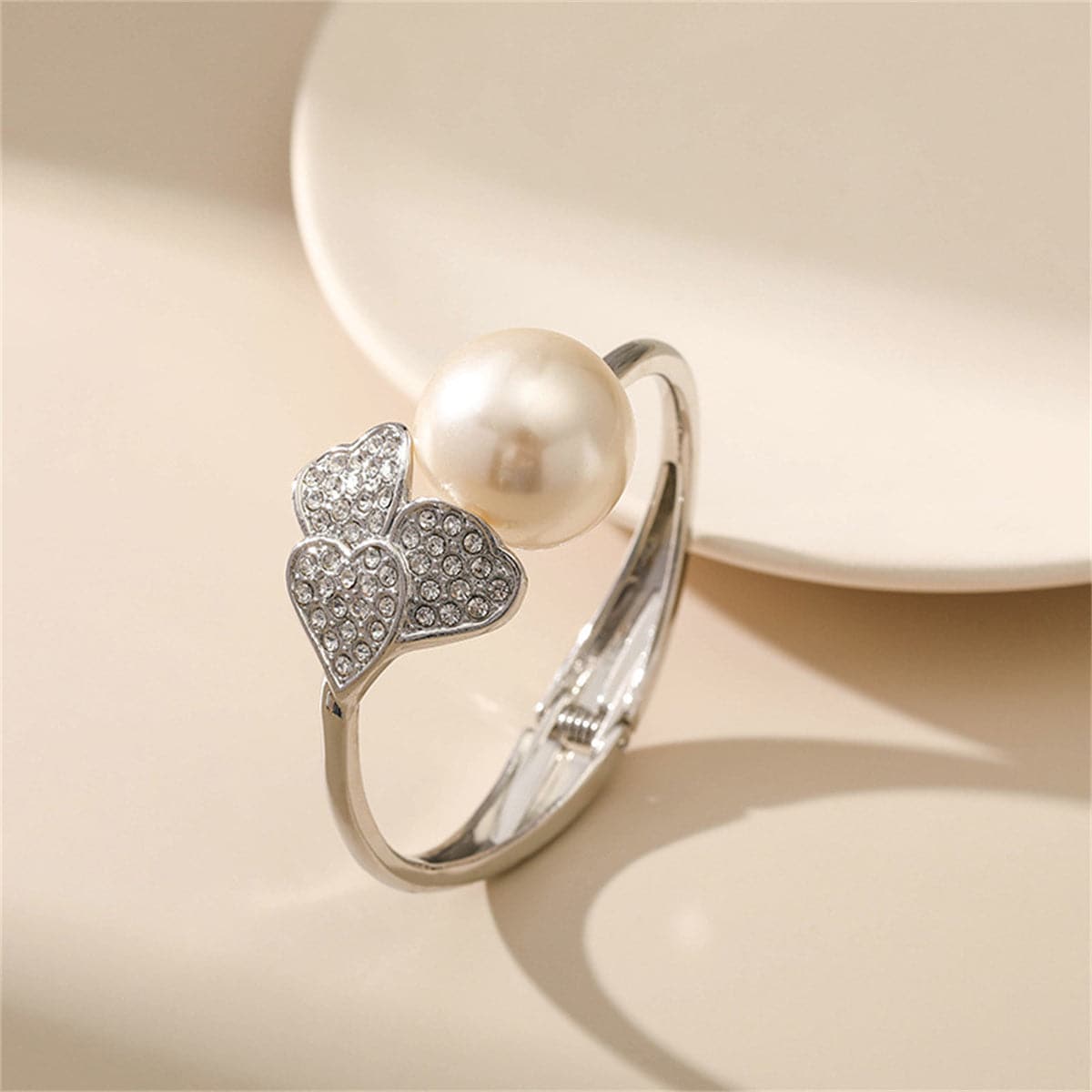 Pearl and Cubic Zirconia Silver-Plated Round Heart Bangle, silver bangle bracelet, dainty minimalist design, side view