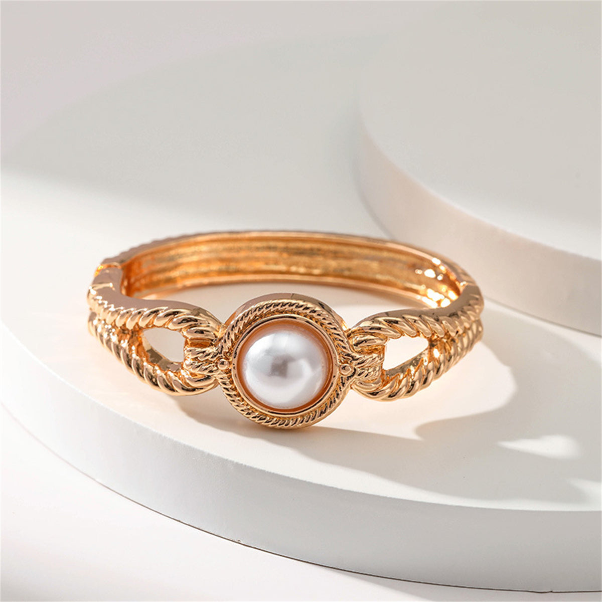 Pearl and 18K Gold-Plated Wing Bangle, gold bangle bracelet, vintage-inspired design, side view