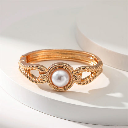 Pearl and 18K Gold-Plated Wing Bangle, gold bangle bracelet, vintage-inspired design, side view