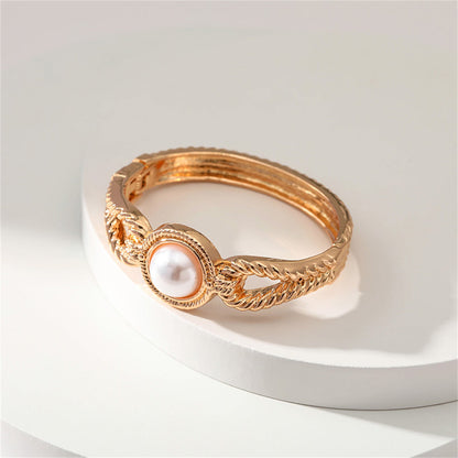 Pearl and 18K Gold-Plated Wing Bangle, gold bangle bracelet, vintage-inspired design, detail close-up