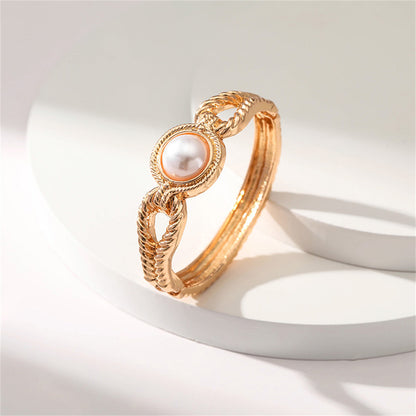 Pearl and 18K Gold-Plated Wing Bangle, gold bangle bracelet, vintage-inspired design, lifestyle look