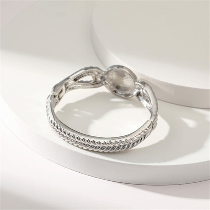 Pearl and Silver-Plated Wing Bangle, silver bangle bracelet, vintage-inspired design, detail close-up