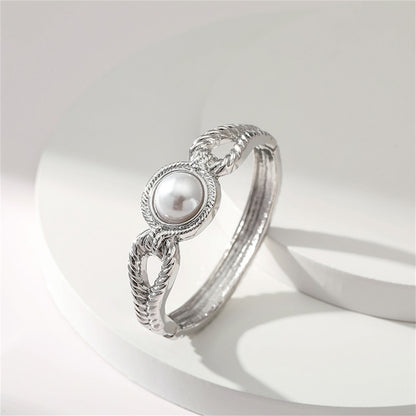 Pearl and Silver-Plated Wing Bangle, silver bangle bracelet, vintage-inspired design, lifestyle look