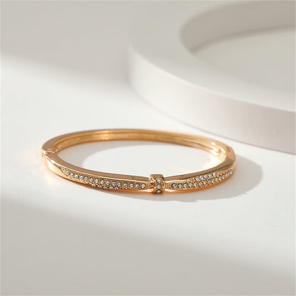 Cubic Zirconia and 18K Gold-Plated Knot Bangle, gold bangle bracelet, vintage-inspired design, lifestyle look