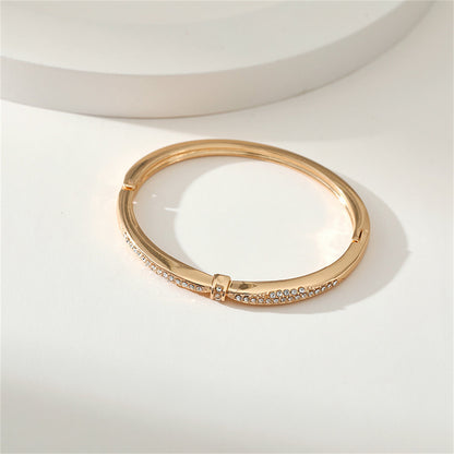 Cubic Zirconia and 18K Gold-Plated Knot Bangle, gold bangle bracelet, vintage-inspired design, styled look