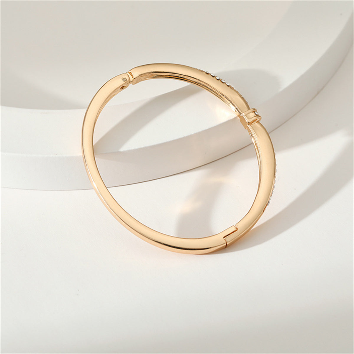Cubic Zirconia and 18K Gold-Plated Knot Bangle, gold bangle bracelet, vintage-inspired design, side view